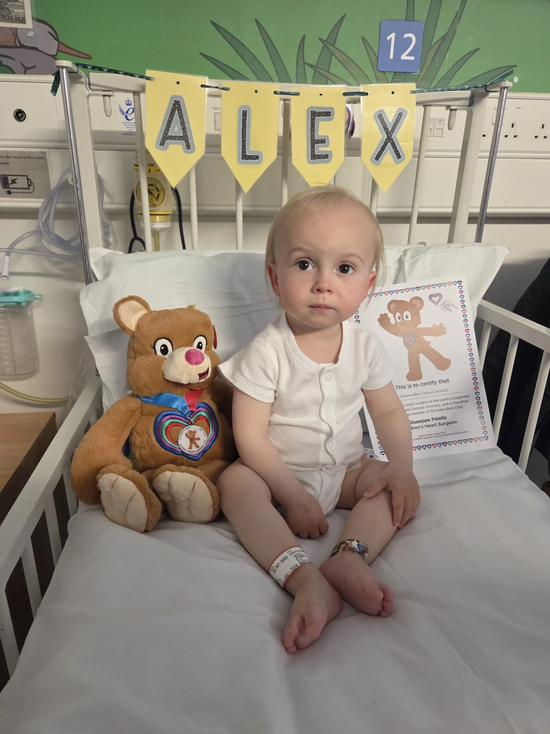 Alex with his Katie Bear after surgery.