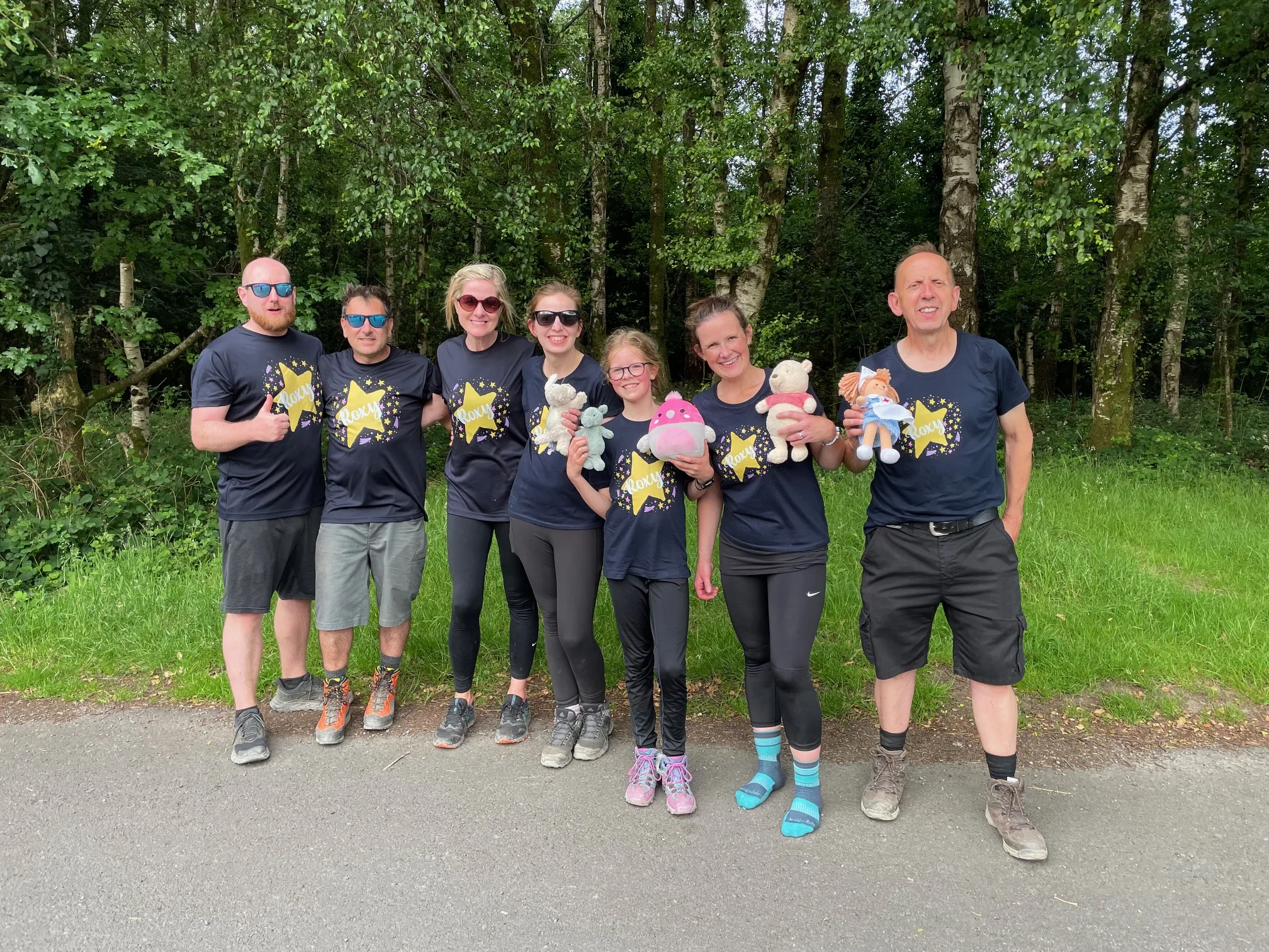 The Jackson Family after walking up Snowdon, all wearing matching Roxy tshirts and holding her cuddly toys