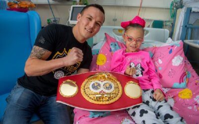 Local boxing champ lauds fighting spirit with charity donation