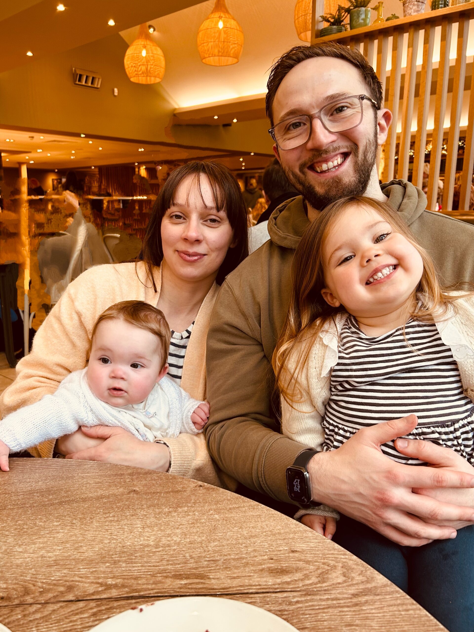 The Jackson Family after walking up Snowdon, all wearing matching Roxy tshirts and holding her cuddly toys