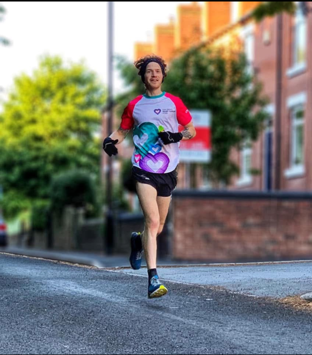 James running in the street, wearing a chsf tshirt