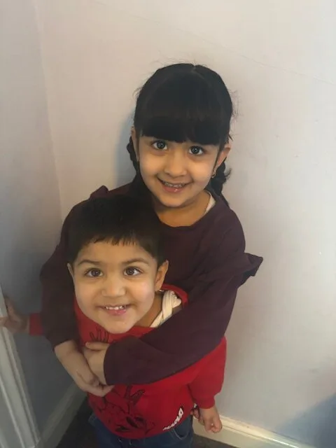 Abdul and his sister, they are both smiling