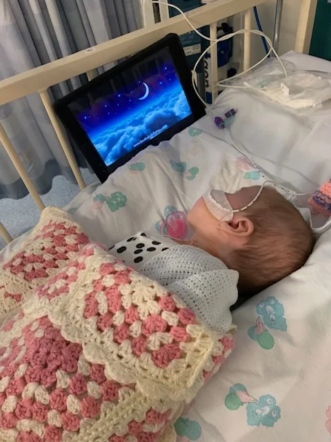 photos of jessica and a friend she met while she was in hospital when she was 8 years old. Two photos of two girls sat together on a hospital bed smiling.
