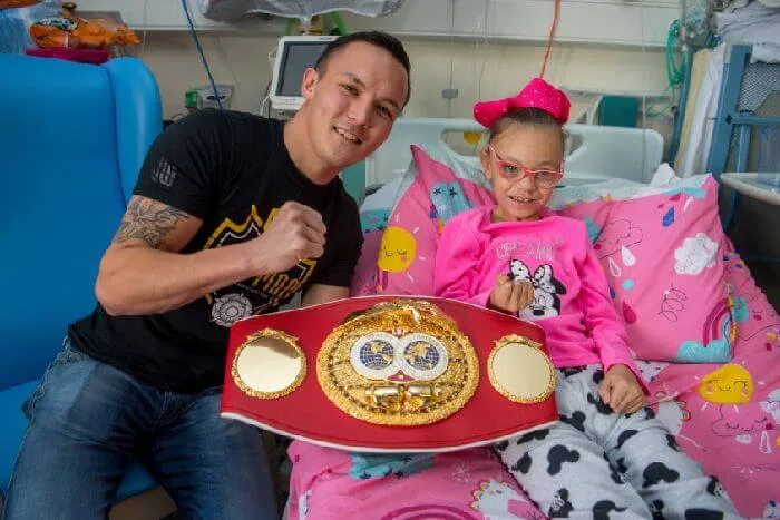 Local boxing champ lauds fighting spirit with charity donation