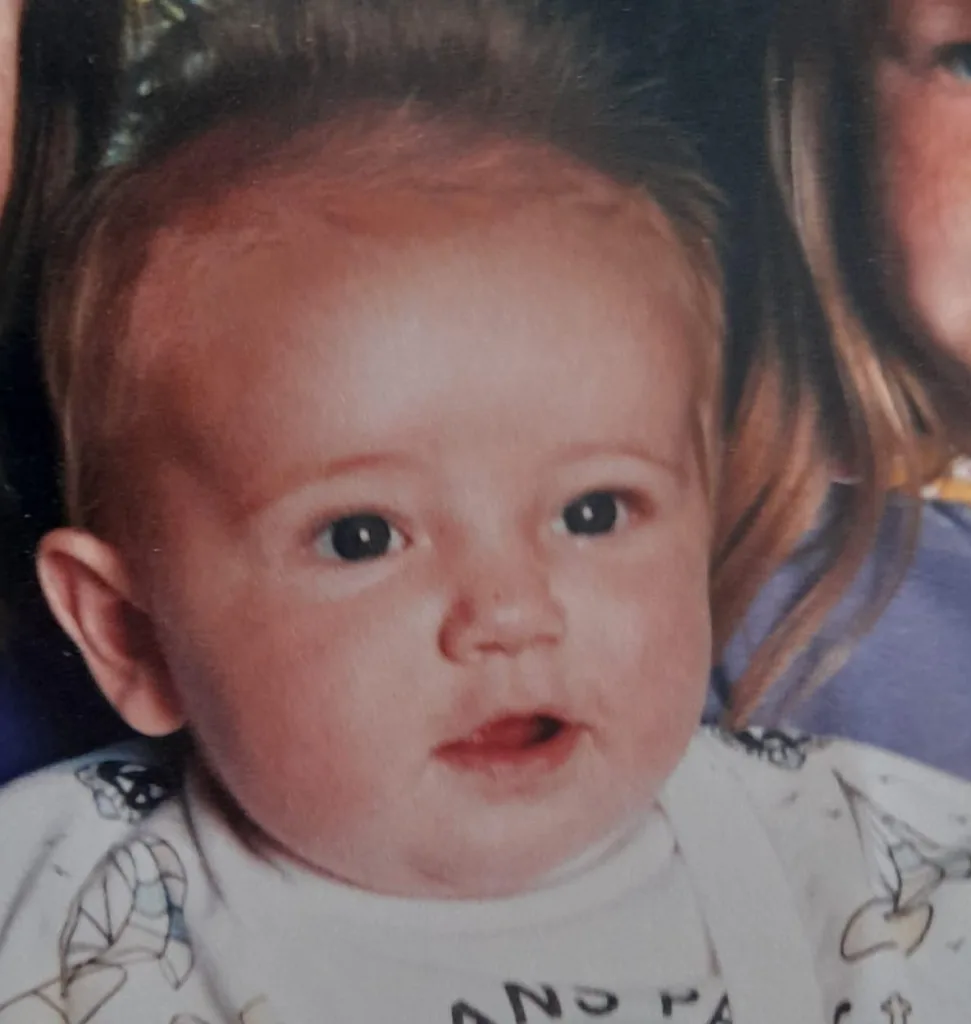 Steven as a baby. He is smiling and has light hair